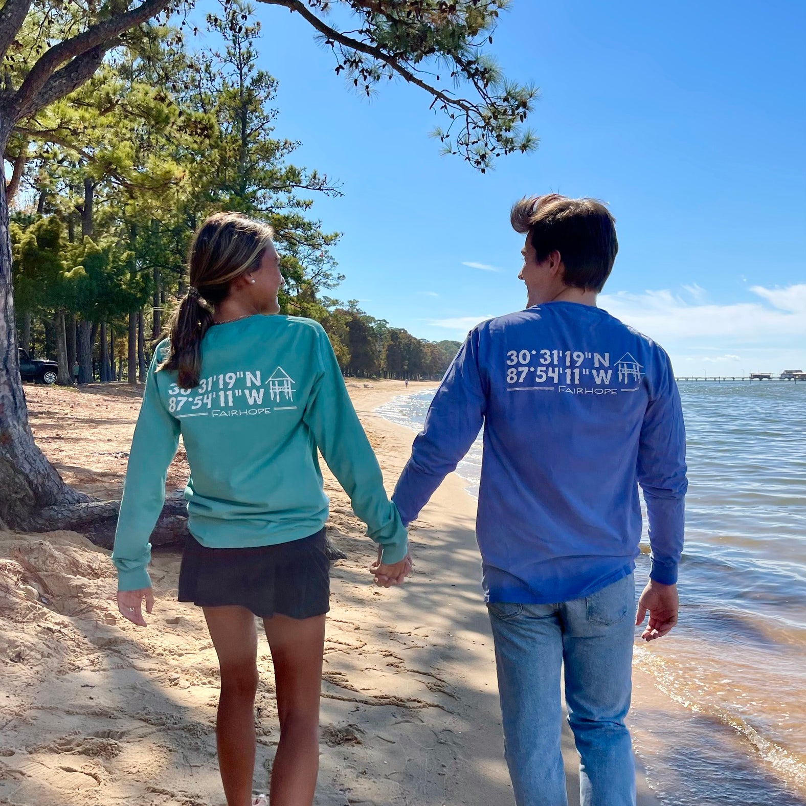couple wearing fairhope store long sleeve shirts