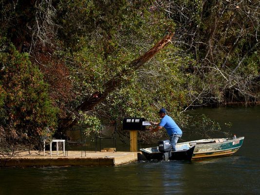 Hang out on Magnolia River and watch the only postal delivery… by boat… in the US.