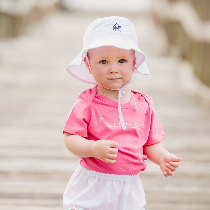 infant wearing fairhope store hat and shirt