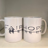 Pair of white coffee mugs from Fairhope Store